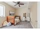 A cozy room with a small bed, vanity and ceiling fan at 900 Wilshire Dr, Berthoud, CO 80513