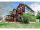 Attractive home featuring a balcony, a covered front porch, and mature landscaping at 900 Wilshire Dr, Berthoud, CO 80513