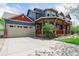 This lovely home includes a large two car garage, a large driveway, and a cozy front porch at 900 Wilshire Dr, Berthoud, CO 80513