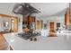 Bright, open kitchen featuring a stainless steel hood vent, island, and modern appliances at 900 Wilshire Dr, Berthoud, CO 80513