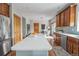 Spacious kitchen with a large center island, stainless steel appliances, and wood cabinetry at 900 Wilshire Dr, Berthoud, CO 80513