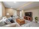 The finished basement includes a cozy living room with a comfortable couch and stylish décor at 900 Wilshire Dr, Berthoud, CO 80513