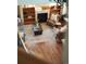 Open-concept living room with a fireplace, built-in shelving, and plenty of natural light at 900 Wilshire Dr, Berthoud, CO 80513