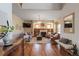 Comfortable living room showcasing hardwood floors, a fireplace, and stylish decor at 900 Wilshire Dr, Berthoud, CO 80513