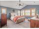 Comfortable main bedroom offering carpet floors, vaulted ceilings, and natural light at 900 Wilshire Dr, Berthoud, CO 80513