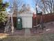 Backyard shed with an antique gas pump and windmills at 11423 Steele St, Thornton, CO 80233