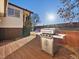 Backyard view with a grill, stairs leading to the house and a clear blue sky at 11423 Steele St, Thornton, CO 80233