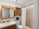 This bathroom features a shower, sink, and built-in cabinetry at 11423 Steele St, Thornton, CO 80233