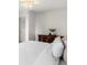 Bright bedroom featuring a ceiling fan, neutral walls, and a wooden dresser at 11423 Steele St, Thornton, CO 80233