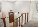 View from the top of the staircase with front door with glass insert and railing at 11423 Steele St, Thornton, CO 80233