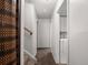 Hallway with neutral walls, stairs, and a laundry nook at 11423 Steele St, Thornton, CO 80233