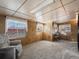 This living room features carpeted floors, window coverings, and neutral paint at 11423 Steele St, Thornton, CO 80233