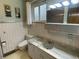 Clean bathroom with a large vanity and updated fixtures at 3515 Pierce St, Wheat Ridge, CO 80033