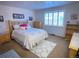 Bright bedroom with a queen-size bed and ample closet space at 3515 Pierce St, Wheat Ridge, CO 80033