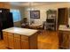 Kitchen with an adjacent dining area and hardwood floors at 3515 Pierce St, Wheat Ridge, CO 80033