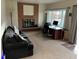 Bright living room featuring a fireplace and large window at 3515 Pierce St, Wheat Ridge, CO 80033