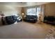 Living room with leather sofas and large window at 3515 Pierce St, Wheat Ridge, CO 80033