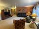 Living room with leather sofas and a large TV at 3515 Pierce St, Wheat Ridge, CO 80033