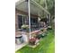 Covered patio with brick flooring and flower pots at 3515 Pierce St, Wheat Ridge, CO 80033