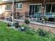 Brick patio with flower pots and seating area at 3515 Pierce St, Wheat Ridge, CO 80033