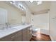 Updated bathroom features a double sink vanity with marble counters and updated shower/bath at 253 Cherokee Pl, Brighton, CO 80603