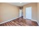 This well lit room offers gorgeous hardwood floors and neutral walls at 253 Cherokee Pl, Brighton, CO 80603