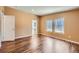 Well lit bedroom with hardwood floors and connected bathroom at 253 Cherokee Pl, Brighton, CO 80603