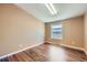 Empty room offers natural light and gorgeous hardwood floors at 253 Cherokee Pl, Brighton, CO 80603