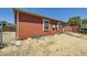 Back of house showing exterior of home and small backyard space at 253 Cherokee Pl, Brighton, CO 80603