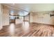 Spacious living room with hardwood floors, open layout, and lots of natural light at 253 Cherokee Pl, Brighton, CO 80603