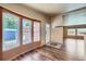 Open living space showcasing hardwood floors, natural light, and easy access to the kitchen at 253 Cherokee Pl, Brighton, CO 80603