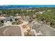 Elevated aerial view showcasing well-kept homes with manicured lawns and mountain views beyond at 1798 Summerglow Ln, Monument, CO 80132