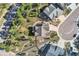 An aerial view of a home with an inviting backyard, professional landscaping, and mature trees at 1798 Summerglow Ln, Monument, CO 80132