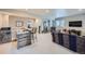 Finished basement with a functional bar area including seating, sink, microwave, and wine fridge at 1798 Summerglow Ln, Monument, CO 80132