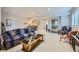 Basement featuring plush carpet, a bar, and an entrance to the stairway to the main level at 1798 Summerglow Ln, Monument, CO 80132