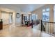 Elegant dining room with modern chandelier and staircase to the lower level at 1798 Summerglow Ln, Monument, CO 80132