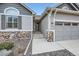 Home with attractive stone veneer details and easy access to the three-car garage at 1798 Summerglow Ln, Monument, CO 80132