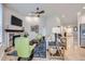 Bright and spacious living room featuring hardwood floors and a stone fireplace at 1798 Summerglow Ln, Monument, CO 80132