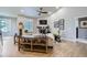 Cozy living room featuring a fireplace, vaulted ceilings, and hardwood floors at 1798 Summerglow Ln, Monument, CO 80132