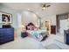 Spacious main bedroom with vaulted ceilings, ample natural light, and a comfortable seating area at 1798 Summerglow Ln, Monument, CO 80132