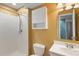 Cozy bathroom with shower, toilet, vanity, and mirror at 9811 Crystallo Ct, Parker, CO 80134