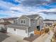 Aerial view of the home featuring a two-car garage and a fenced backyard at 11450 Booth Falls Ct, Parker, CO 80134