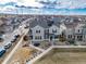 Beautiful aerial view of a well-maintained two-story home with solar panels in a suburban neighborhood at 11450 Booth Falls Ct, Parker, CO 80134