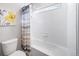 Well-lit bathroom showcasing a shower-tub combination with stylish curtain at 11450 Booth Falls Ct, Parker, CO 80134