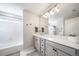 Bright bathroom featuring double sinks, modern lighting, and ample counter space at 11450 Booth Falls Ct, Parker, CO 80134