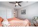 Cozy bedroom featuring a ceiling fan, closet, and soothing wall decor at 11450 Booth Falls Ct, Parker, CO 80134