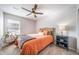 Cozy bedroom featuring a ceiling fan and ample natural light at 11450 Booth Falls Ct, Parker, CO 80134