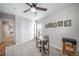 Bedroom with closet and workspace area illuminated by a ceiling fan at 11450 Booth Falls Ct, Parker, CO 80134