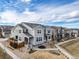 Street view of a residential community with solar panels and sidewalks at 11450 Booth Falls Ct, Parker, CO 80134