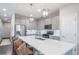 Modern kitchen with an island and stainless steel appliances and seating at 11450 Booth Falls Ct, Parker, CO 80134